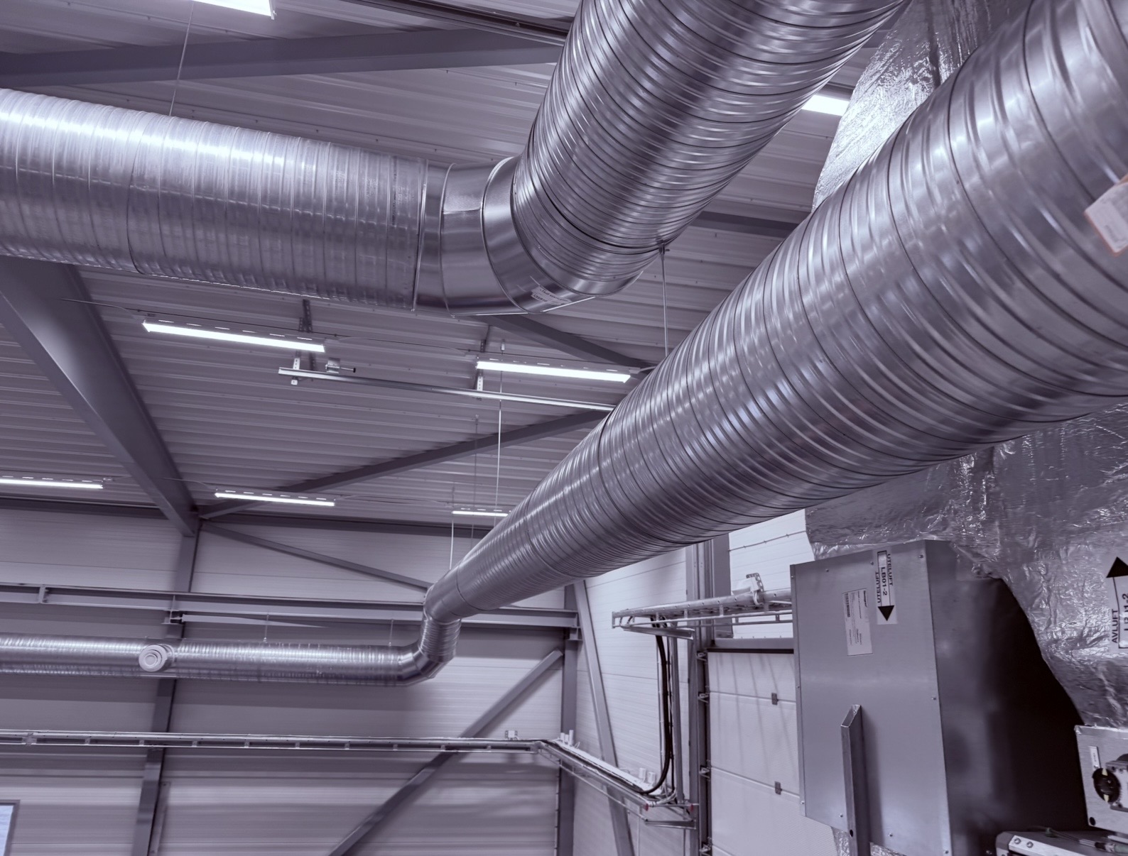 HVAC service worker working on bathroom ventilation exhaust fan